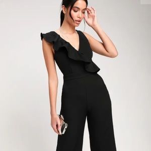 SURE TO BE SEEN BLACK SLEEVELESS RUFFLED JUMPSUIT